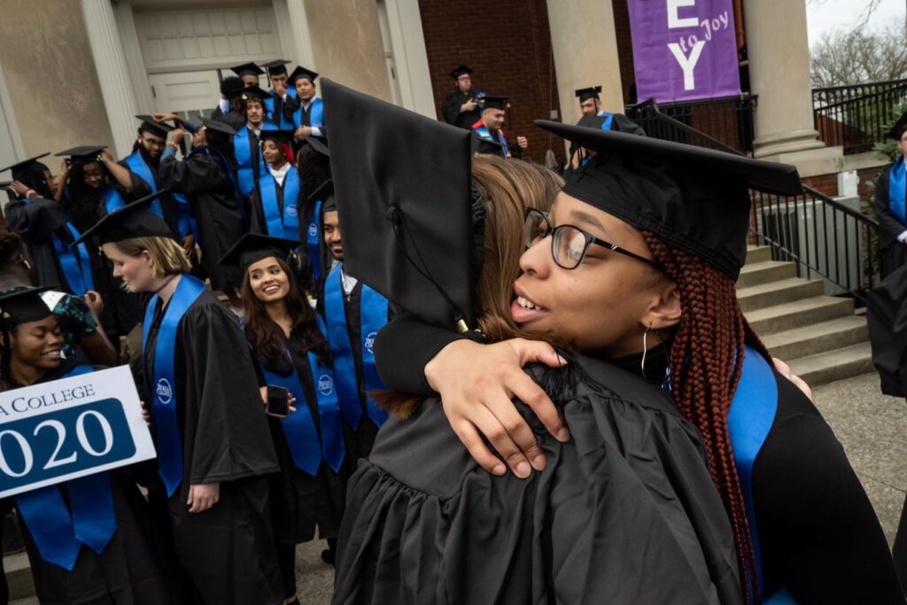 Class of 2020 grads hugging