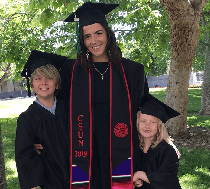 Class of 2019 grad with two children