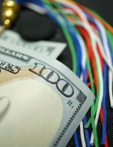 Photo of money with graduation cap and tassle