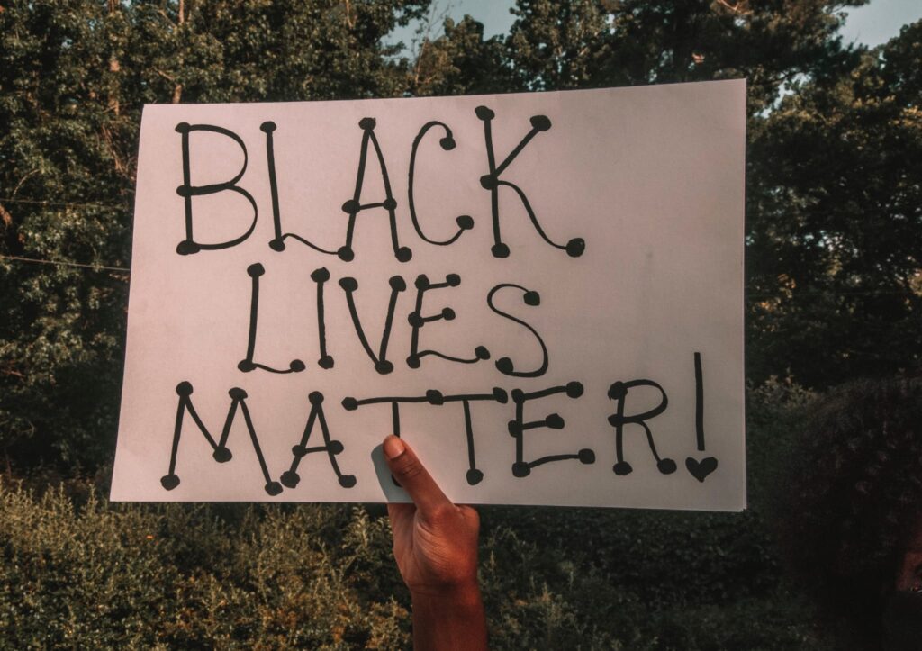hand holding Black Lives Matter sign